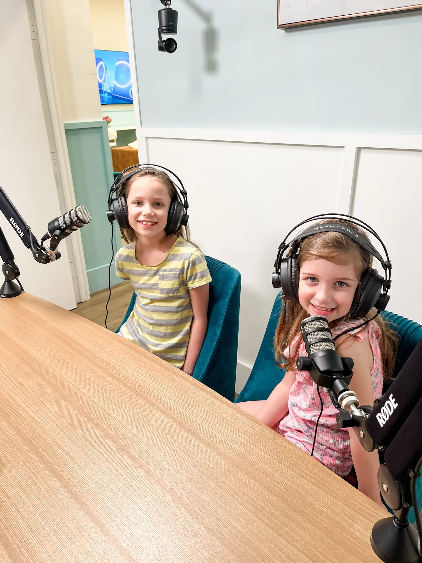 Two young guests recording with microphones in The Wurzbach Studio