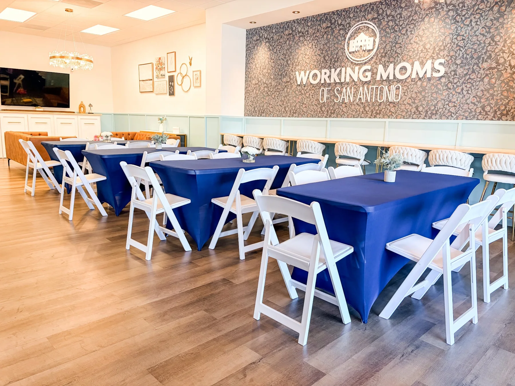 The WMSA event space arranged with navy linens for a seated gathering